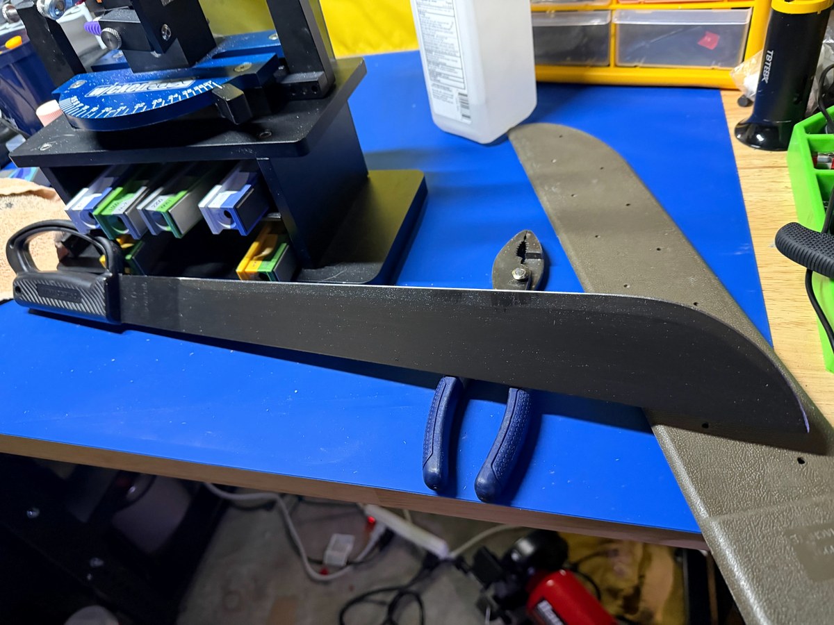 Machete on sharpening workbench